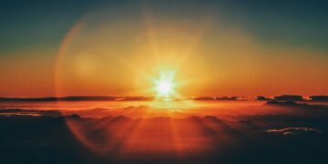 calm body of water during sunset