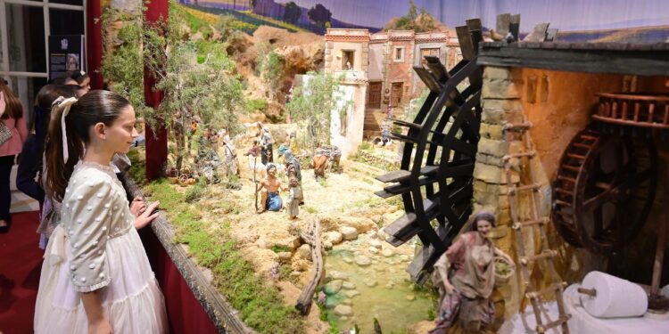 Valencia inaugura sus belenes municipales con un coro de niños y la FMI de Valencia con su Corte de Honor